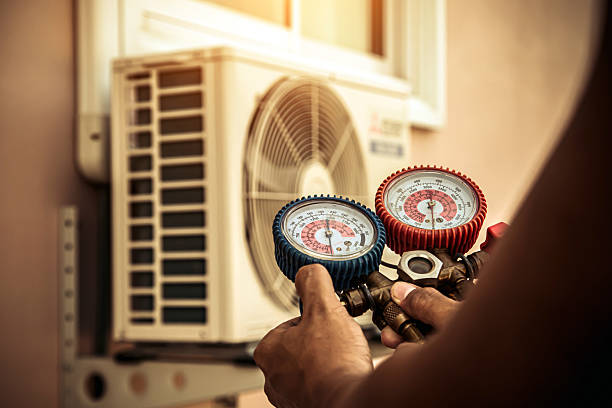 Professional Air Conditioning Service technician working in North Easton, MA
